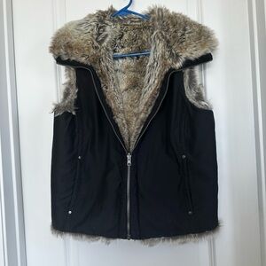 Reversible, faux fur vest. Stylish and warm worn either way.